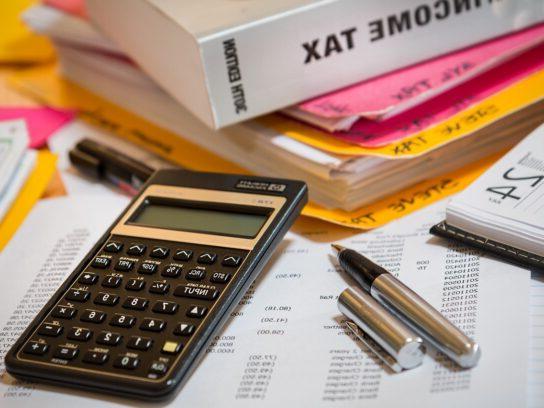 calculator pens and income tax book